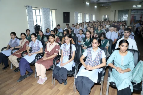 Audience view of students and teachers inside the BDRKA auditorium