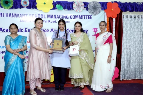 Student receiving award and certificate at the HSMC ceremony